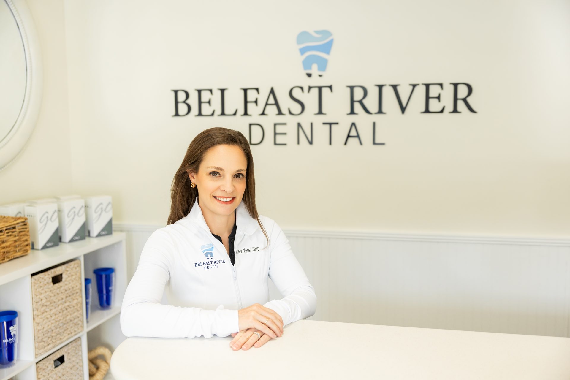 Dr. Nicole Yates at the Belfast River Dental front desk